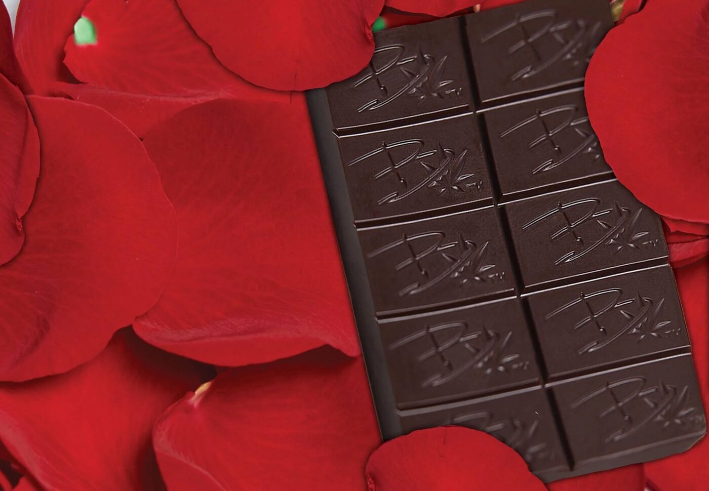 Bhang dark chocolate bar on red rose petals