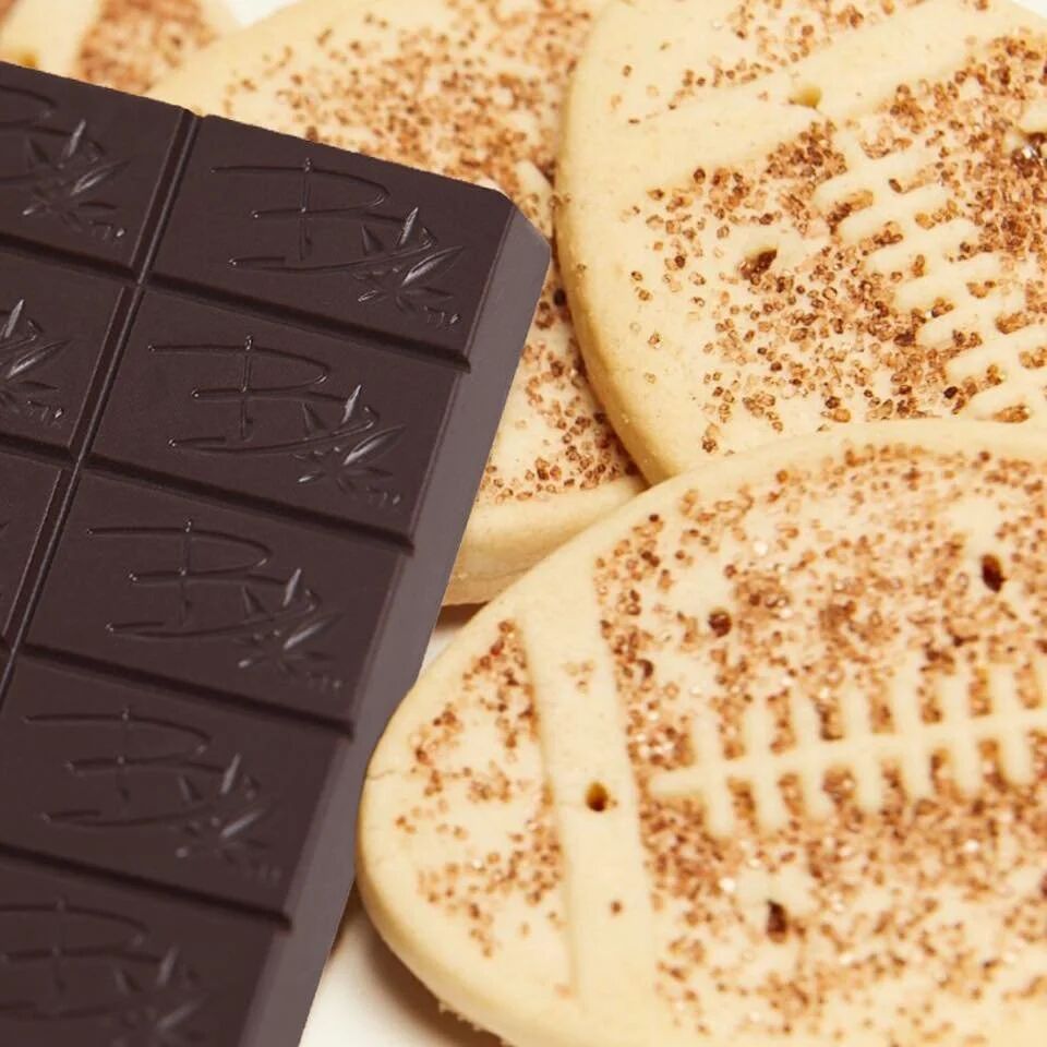 Close-up of a Bhang dark chocolate bar on shortbread cookies