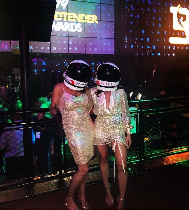 Two performers in sequined dresses and astronaut helmets at the Budtender Awards