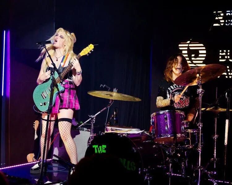 Guitarist and drummer of a punk band performing at Budtender Sessions