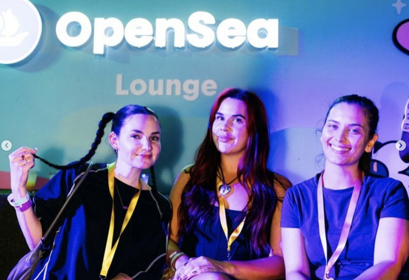 Three speakers seated on a panel in the OpenSea Lounge at DoodlePutt