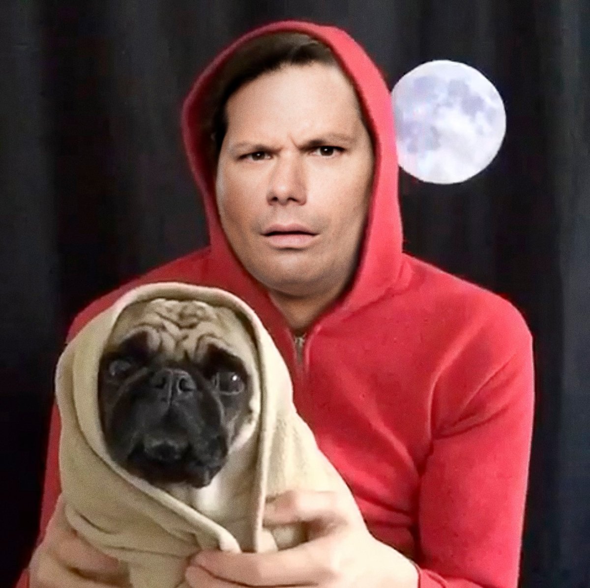 Michael Ian Black as Elliott from E.T., holding a pug