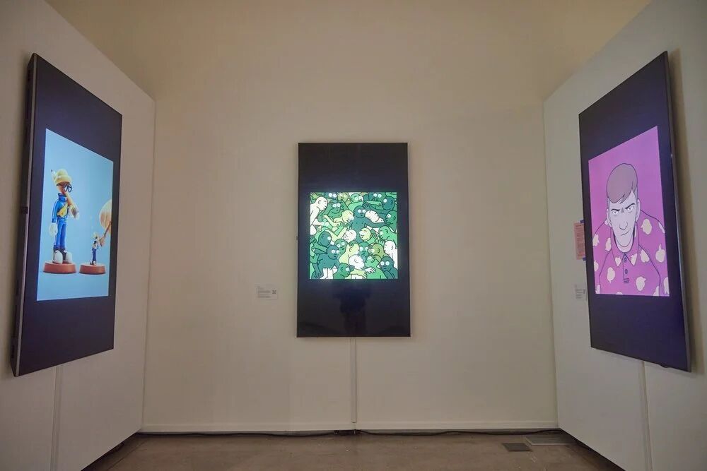 Three framed digital artworks on display in the OpenSea gallery