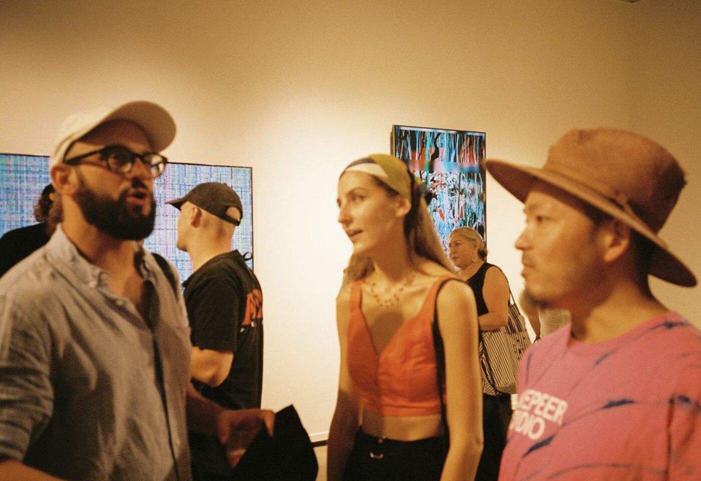 Guests chatting in the OpenSea gallery