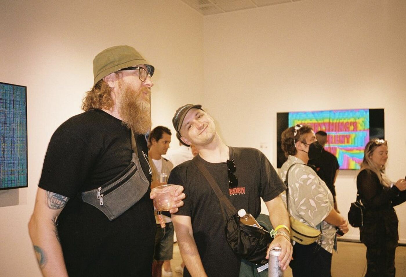 Two guests laughing in the OpenSea gallery