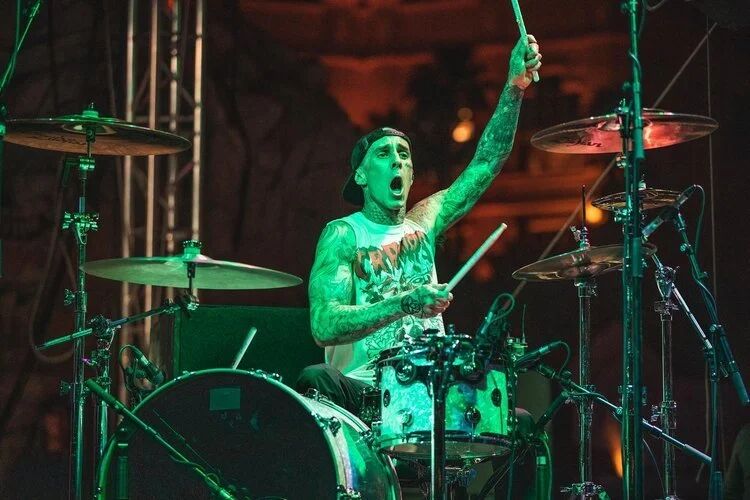 Travis Barker drumming on stage at G4 Live