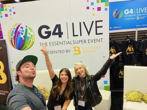 Attendees taking a selfie at the G4 Live booth