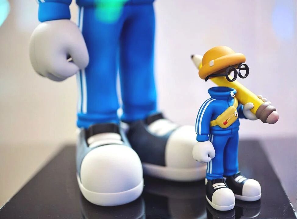 Close-up of the Invisible Friends toy beside a larger version