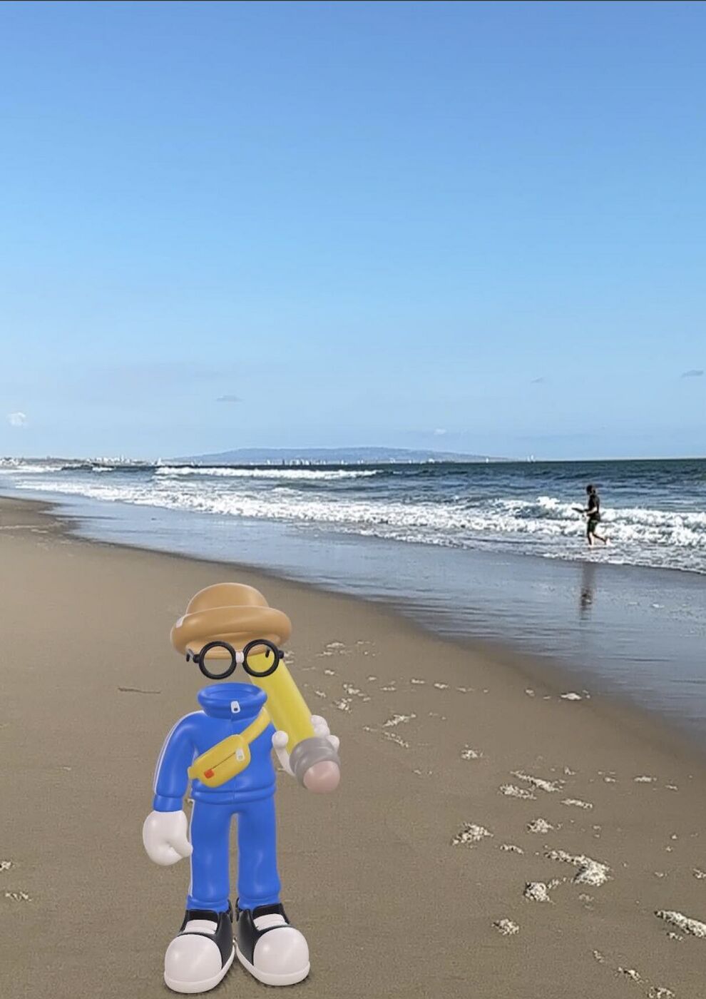 Invisible Friends toy on a beach at the water's edge