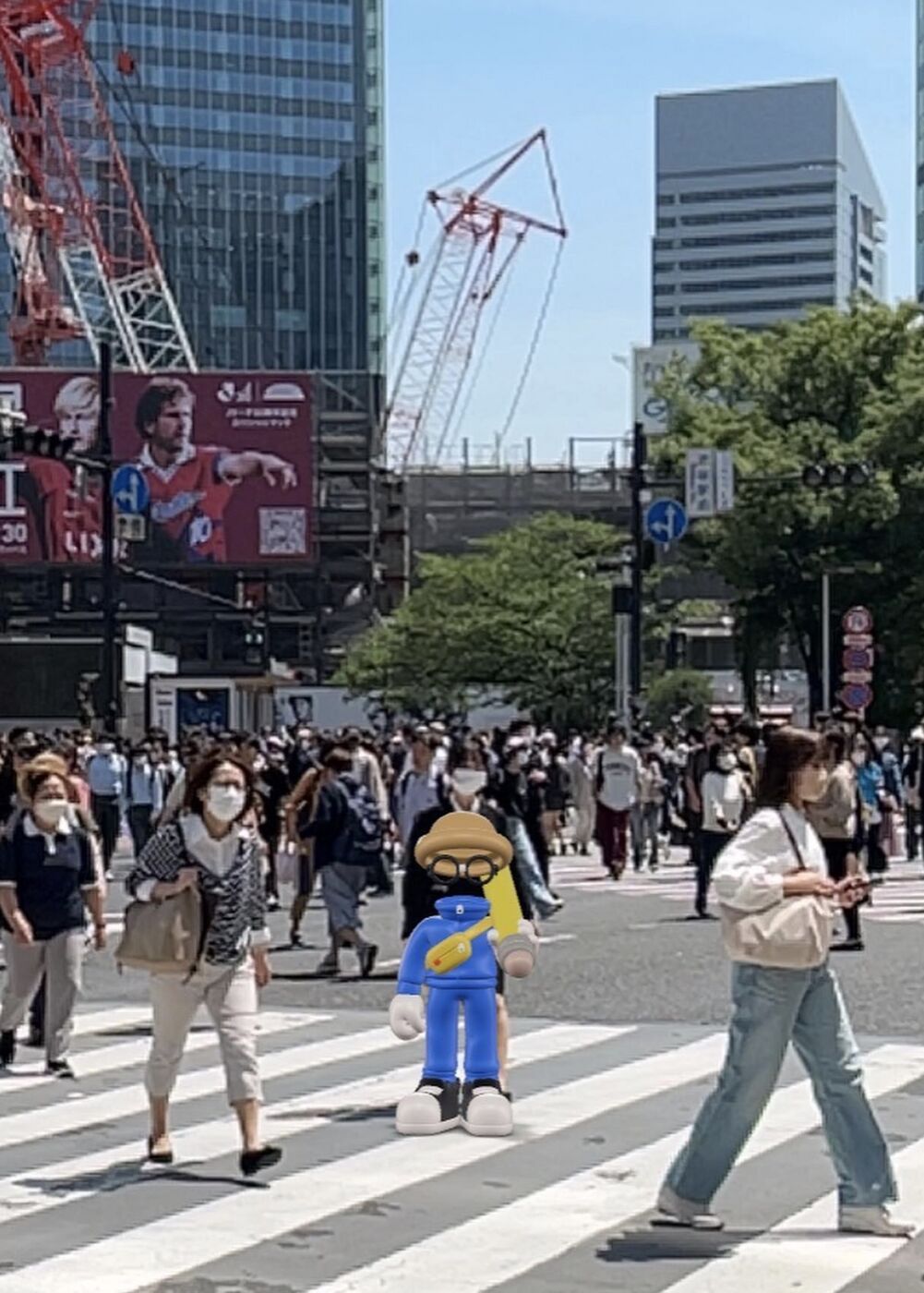 Invisible Friends toy at a busy Tokyo crosswalk