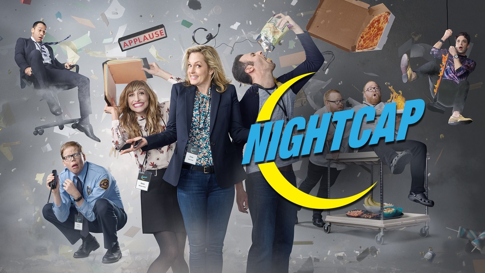 Nightcap wide key art with the cast amid flying debris