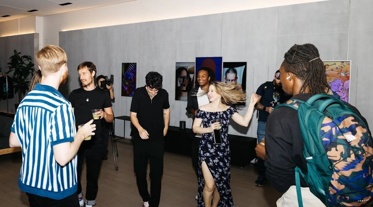 Guests mingling at the Pride Perspectives gallery opening