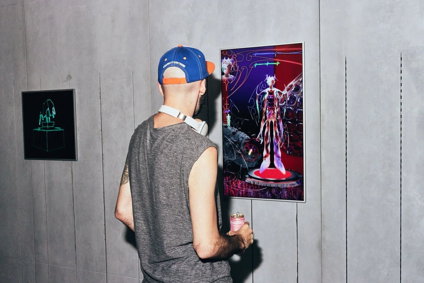 Guest viewing a digital artwork at the Pride Perspectives gallery