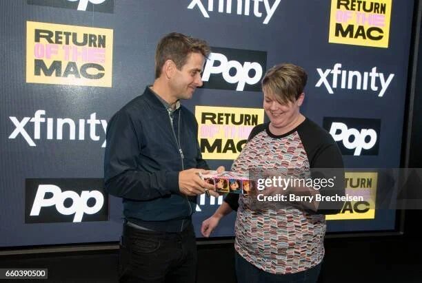 Joey McIntyre signing for a fan at the Return of the Mac Xfinity meet and greet