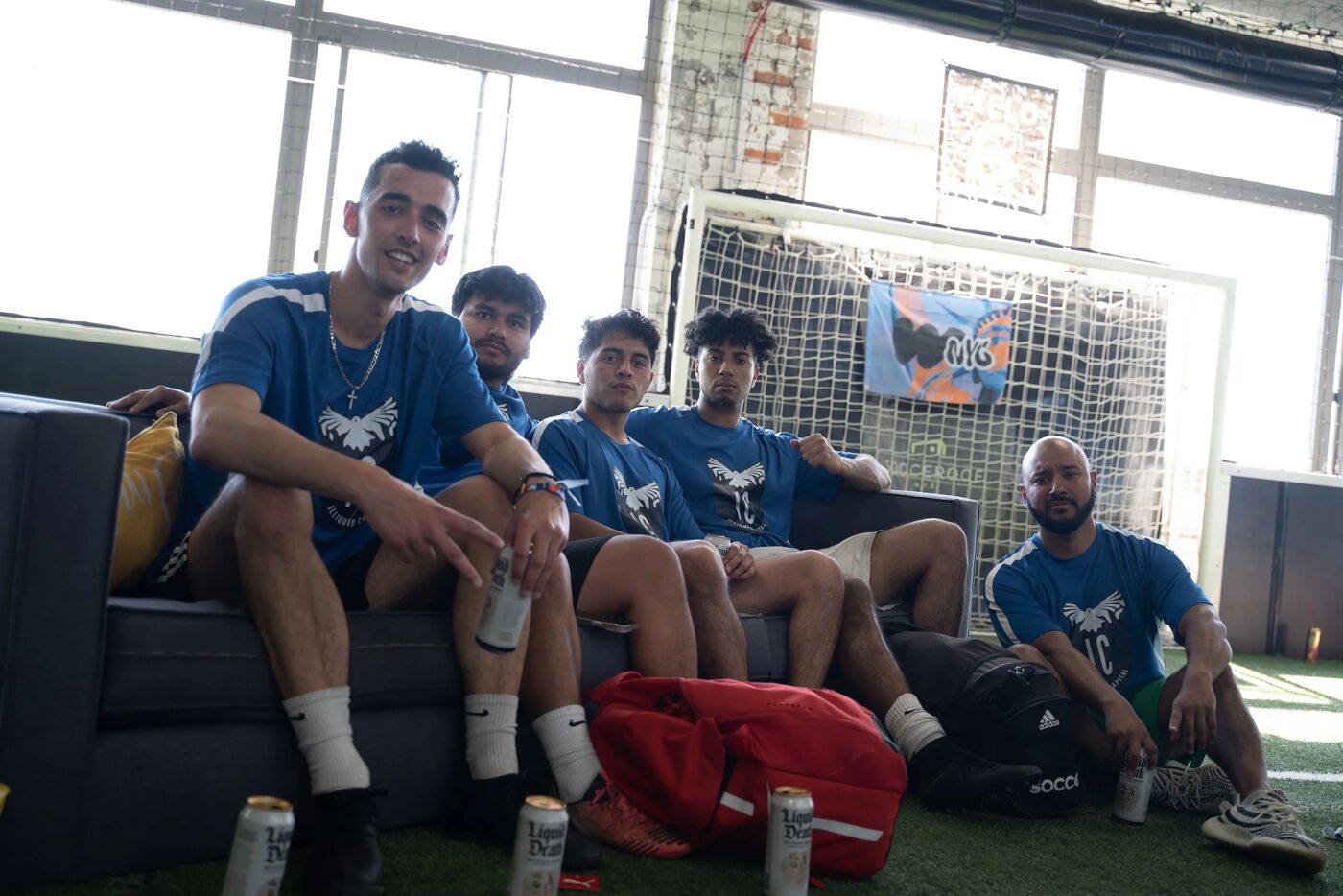 Team in blue kits relaxing on a couch at W3FC