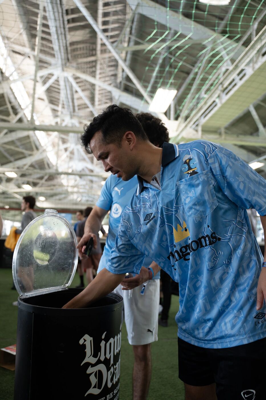 Players in OpenSea jerseys at a Liquid Death cooler
