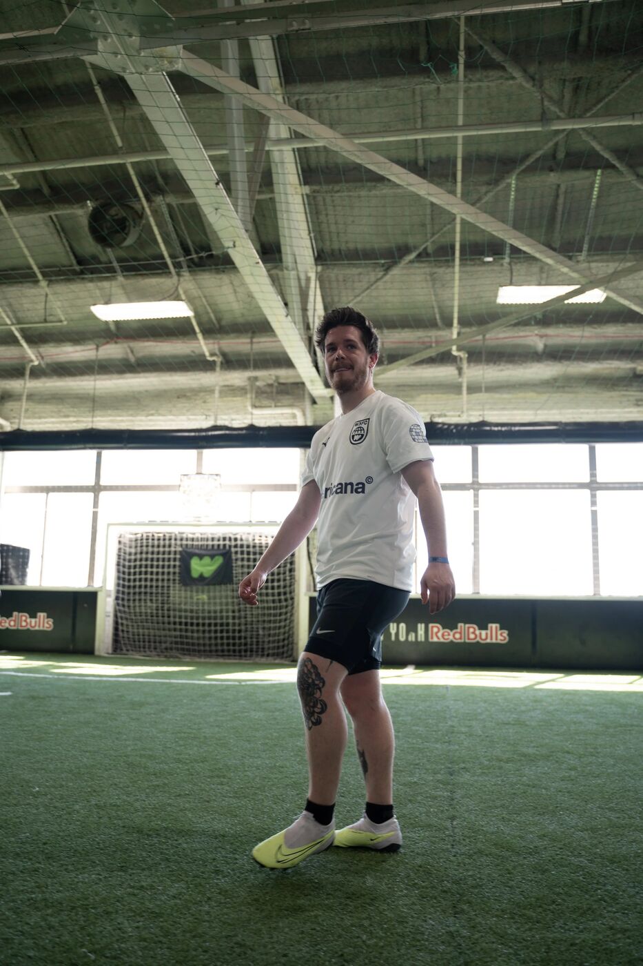 Player in a white kit walking on the turf