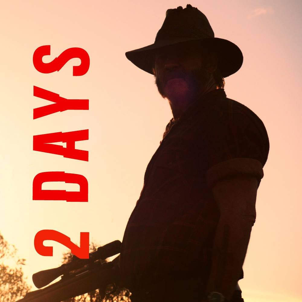 Wolf Creek premiere countdown: 2 days. Mick Taylor in silhouette holding a rifle at sunset