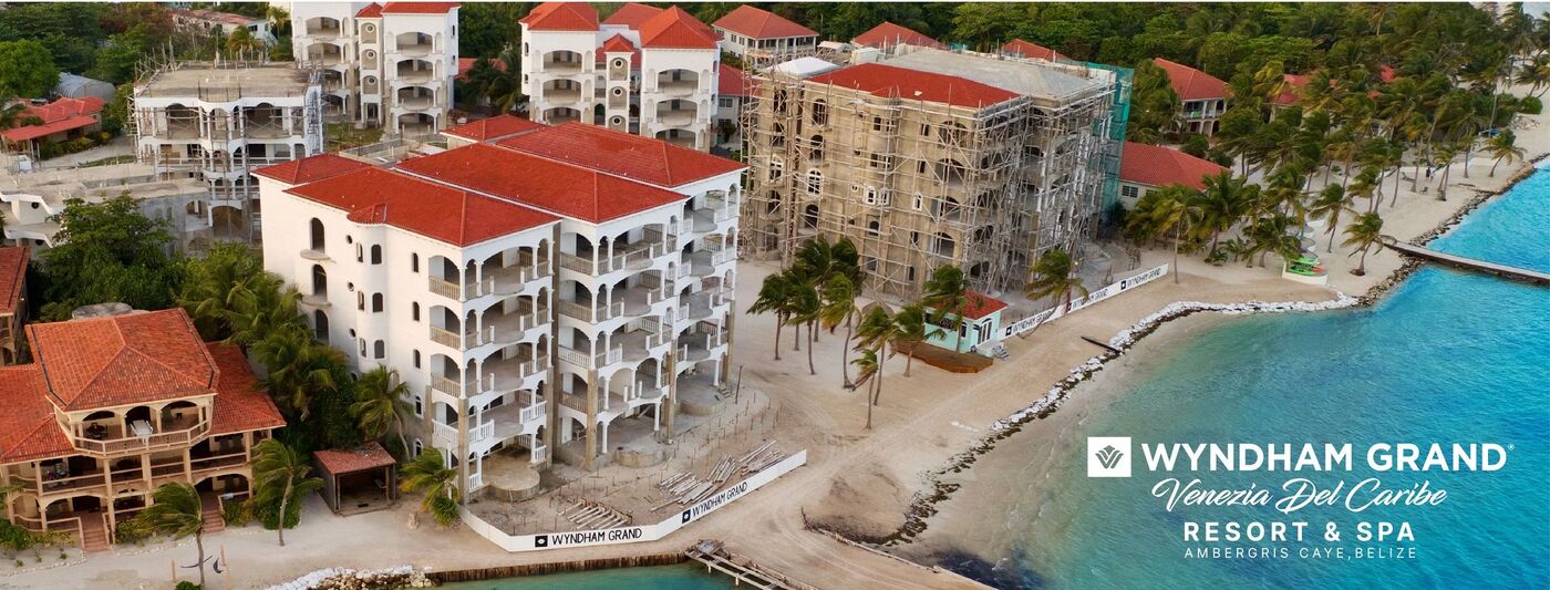 Aerial banner of the Wyndham Grand Belize resort on the waterfront